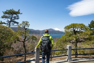 Tourist enjoying the view, Benten-no-hana Tenbodai viewpoint, Hakone Park, view of Lake Ashi with