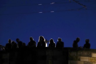 Tourists in Dresden on a bridge in the evening, Saxony, Germany
