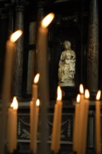 Prayer candles and Bruges Madonna, sculpture by Michelangelo from 1501 to 1506, Moscron chapel of