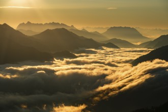 Silhouette of mountains at dusk, fog in the valley, Wilder Kaiser and Chiemgau Alps, Upper Bavaria,