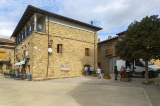 People buying bread from van shop, medieval village of Isuerre, Val d'Onsella, Zaragoza province,