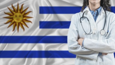 Medical professional on Uruguay flag. Healthcare and wellness in Uruguay, Concept