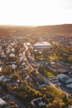 Aerial view of a village at sunset with roads and houses, Großbottwar, Germany