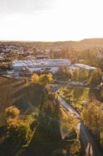 Urban landscape at sunset with autumn trees and golden light, Großbottwar, Germany