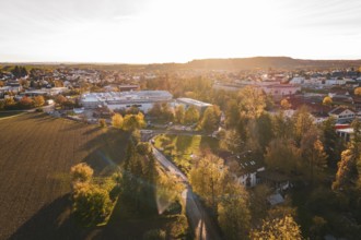 Landscape view at sunset with trees and urban buildings in autumn, Großbottwar, Germany