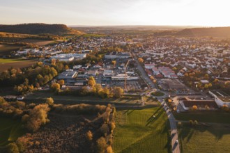 Overview of a town in autumn, surrounded by fields, at sunset, Großbottwar, Germany