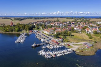Aerial view over sailing boats in the harbour, marina of the village Kirchdorf in the Bay of