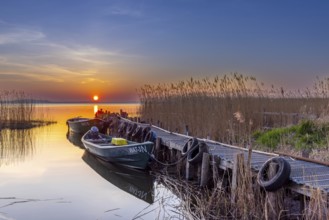 Fishing boats at wooden jetty on Lieper Winkel peninsula near Rankwitz on Usedom island in the