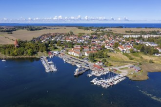 Aerial view over sailing boats in the harbour, marina of the village Kirchdorf in the Bay of