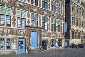 Façade of 17th century baroque guildhall Korenmetershuis at the Graslei in the city Ghent, East