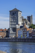 16th century Gothic Notre-Dame collegiate church along the Meuse river in the city Huy, province of