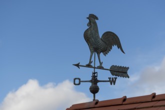 Weather vane on roof against clear blue sky, peaceful atmosphere, Baden-Württemberg, Germany