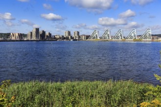 View across Skyttehusbugten Bay to the wave-shaped residential complex Bølgen, Die Welle, architect