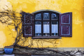 Round arch window with shutters with yellow façade, Dießen am Lake Ammer, Upper Bavaria, Bavaria,