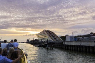 Harbour ferry line 62 with passengers on the Elbe, harbour cruise at sunset, Docklands, Hamburg,