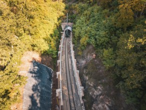 Rail construction site in the forest taken from the air with tunnel boring machine, construction of