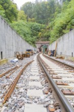 Track construction at a tunnel in the forest under clear skies, construction of Hermann, Hesse,