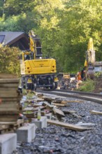 A construction site in the forest with construction machinery and rail works, construction of