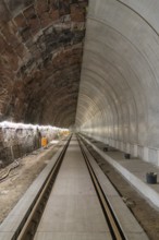 An empty tunnel with rails and lighting on a railway line, built by Hermann, Hesse, Bahn, Calw,