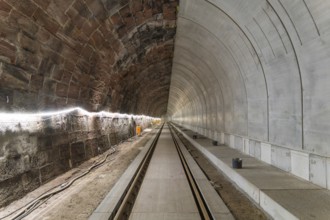 Empty tunnel with rails and cables along the wall, Bau der Hermann, Hesse, Bahn, Calw, Germany
