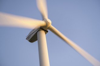 Wind turbine in full motion under a blue sky, Baden-Württemberg, Germany