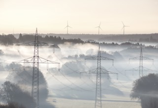 Morning atmosphere with foggy landscape and power poles in the foreground, Swabian Jura,