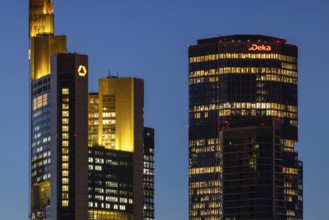 The towers of Commerzbank and Deka Bank in Frankfurt am Main light up in the evening, Frankfurt am