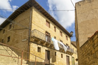 Washing drying on balcony of historic house, medieval village of Uncastillo, Cinco Villas, Zaragoza