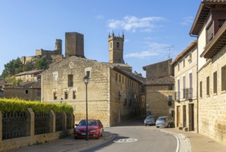 Castle and church in medieval village of Uncastillo, Cinco Villas, Zaragoza province, Aragon, Spain
