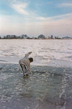 Boy on ice rink, frozen Elbe, Bleckede, Lower Saxony, Germany, January 03, 1997, vintage, retro,