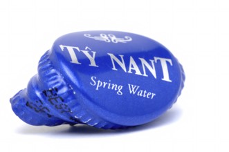 Screw cap of a water bottle, mineral water, Ty Nant, in blue designer bottle, water from Wales, is