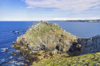 Seascape view to the horizon from a rocky coast a sunny summer day by the sea, Crozon peninsula,