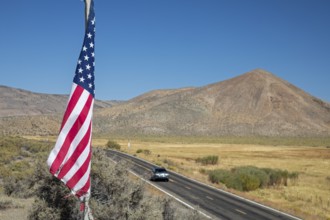 Austin, Nevada - A flag flies in the Nevada desert above state highway 305. The flag is on the site