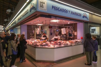 Market stall shop store selling fish and seafood inside Mercado Central de Zaragoza, Zaragoza,