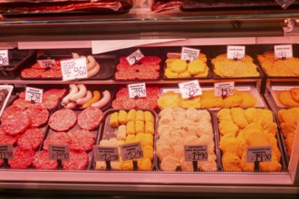 Market stall shop store selling butcher meat products inside Mercado Central de Zaragoza, Zaragoza,