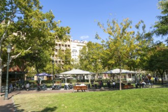 People at outdoor cafe in public park, Plaza de los Sitios de Zaragoza, Zaragoza, Aragon, Spain