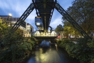 Night view of the Wuppertal suspension railway at Ohligsmühle station, Wuppertal, Germany,