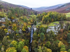 Autumn colours over Pistyll Rhaeadr Waterfall and Berwyn Mountains from a drone, Oswestry,