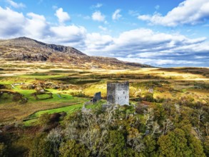 Autumn colours over Castell Dolwyddelan and Eryri Mountains from a drone, Snowdonia, Conwy County