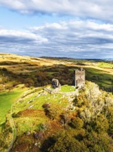 Autumn colours over Castell Dolwyddelan and Eryri Mountains from a drone, Snowdonia, Conwy County