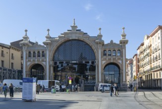 People vehicles street by central market building, Mercado Central de Zaragoza, Zaragoza, Aragon,