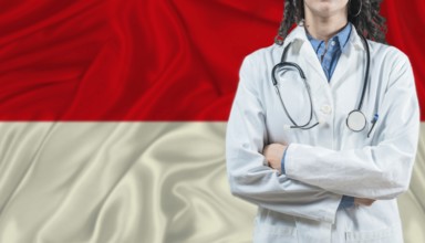 Medical professional on Indonesia flag. Healthcare and wellness in Indonesia, Concept
