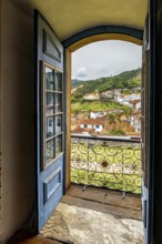 The city of Ouro Preto viewed through the doorway of one of its historic Baroque churches, Ouro