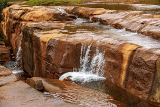 River flowing over rocks and forming small waterfalls in the state of Minas Gerais, Brazil, Minas