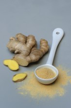 Ginger root and ginger powder in spoon, Zingiber officinale