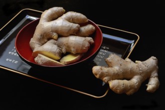 Ginger, ginger root in tea bowl, Zingiber officinale, tea preparation
