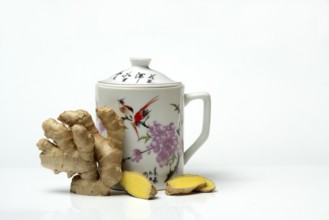 Ginger root with cup, ginger tea
