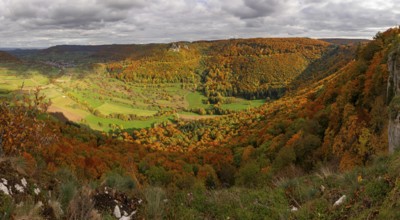 Panoramic picture of Indian Summer on the Swabian Jura in the Nenninger Valley with Reussenstein