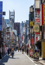 Lots of colorful signs of shops, restaurants and bars in a street, Shinjuku City, Tokyo, Japan