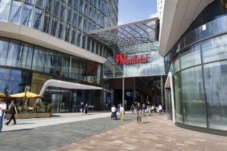Westfield Überseequartier, shopping center, adventure center with passers-by, logo, lettering on